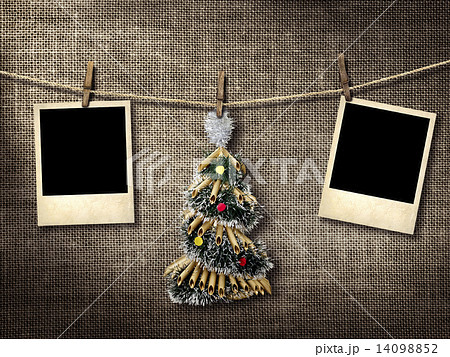 Old style photographs and Christmas tree hanging on a clotheslin 14098852
