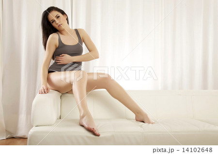 Beautiful and attractive female woman posing in grey shirt on th Beautiful and attractive female woman posing in grey shirt on th 14102648