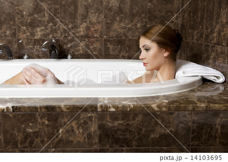Woman in bath relaxing. Closeup of young woman in bathtub bathin Woman in bath relaxing. Closeup of young woman in bathtub bathin 14103695
