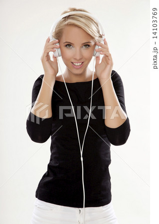 Beautiful girl is listen to the music 14103769
