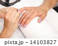 Manicure - Beautiful manicured woman's nails with violet nail po 14103827