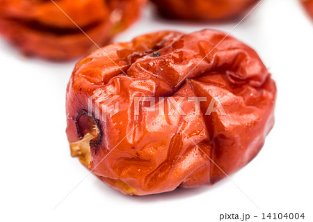 Close up and selective focus on the dried Chinese Red Dates at the foreground 14104004