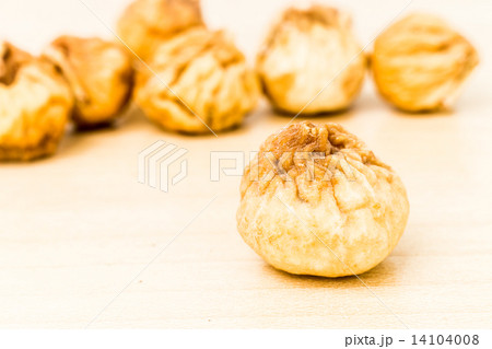 Close up and selective focus on the dried figs at the foreground 14104008
