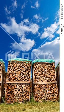 Pile of Chopped Firewood on Blue Sky Pile of Chopped Firewood on Blue Sky 14105052