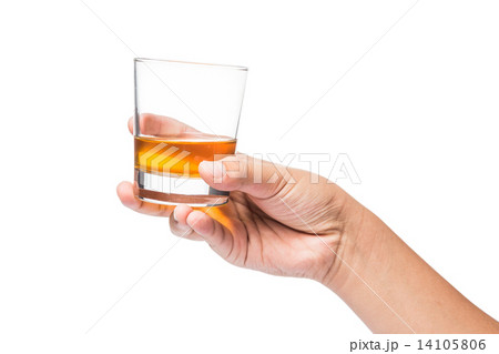 Hand holding a glass of whiskey 14105806