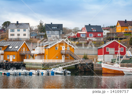Norwegian fishing village, wooden houses on the sea coast 14109757