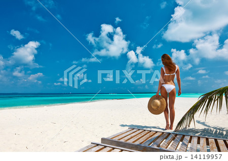 Woman in bikini on a beach at Maldives Woman in bikini on a beach at Maldives 14119957