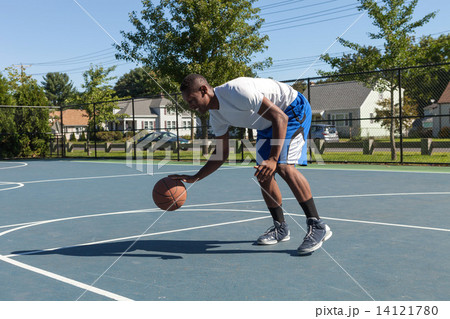Basketball Player Dribbling 14121780