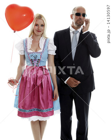Woman in Dirndl with Bodyguard Woman in Dirndl with Bodyguard 14130597