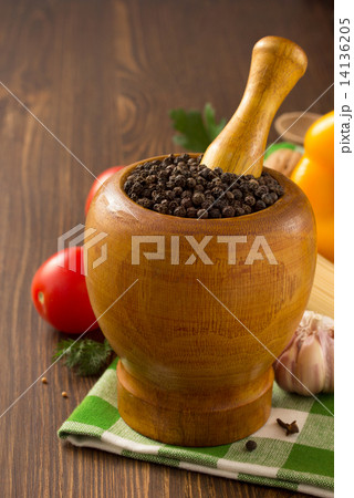 mortar with pestle and spices on wood mortar with pestle and spices on wood 14136205