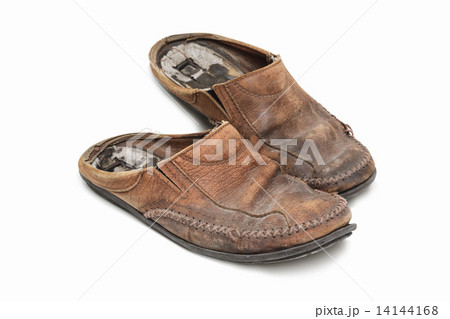 Old shoes on the white background. Old shoes on the white background. 14144168