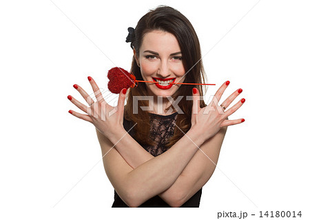 Erotic looking woman with red lipstick holding Valentine heart i Erotic looking woman with red lipstick holding Valentine heart i 14180014