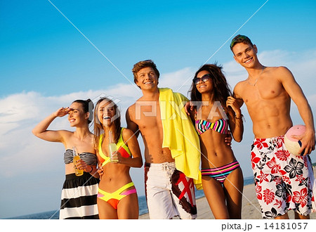 Group of multi ethnic friends walking on a beach 14181057