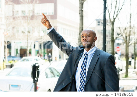 Man Hailing a Taxi Cab Man Hailing a Taxi Cab 14186619