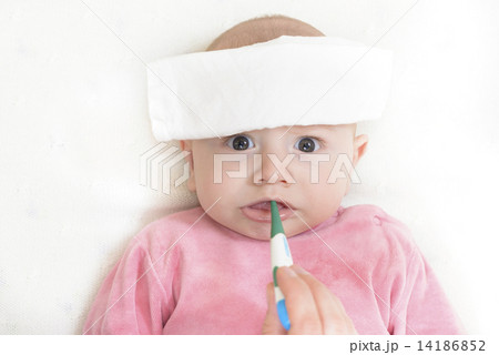 Checking temperature with digital thermometer 14186852