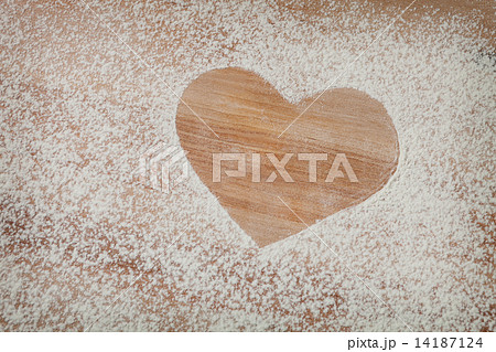 The heart of the flour on the table from the old boards The heart of the flour on the table from the old boards 14187124