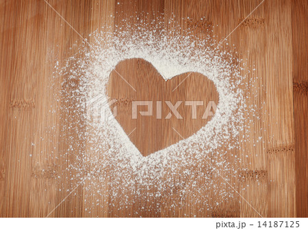 The heart of the flour on the table from the old boards The heart of the flour on the table from the old boards 14187125