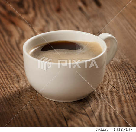 A cup of coffee on the table of the old boards A cup of coffee on the table of the old boards 14187147
