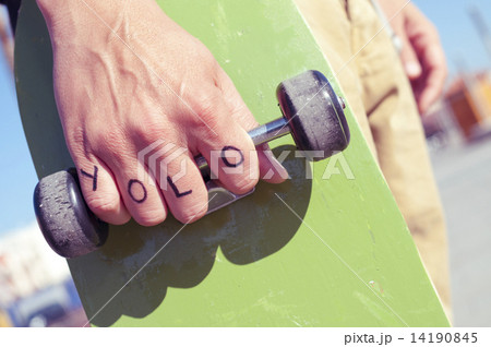 young man with the word yolo, for you only live once, tattooed i 14190845