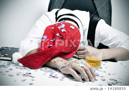 man sleeping in the office after a christmas party man sleeping in the office after a christmas party 14190850