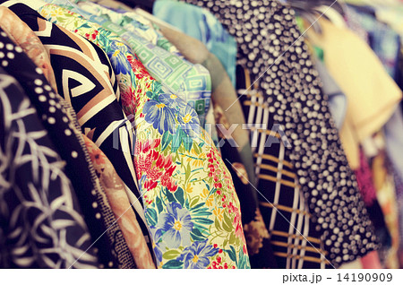 clothes hanging on a rack in a flea market clothes hanging on a rack in a flea market 14190909