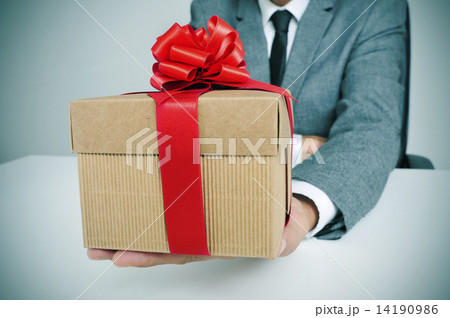 man in suit with a gift 14190986