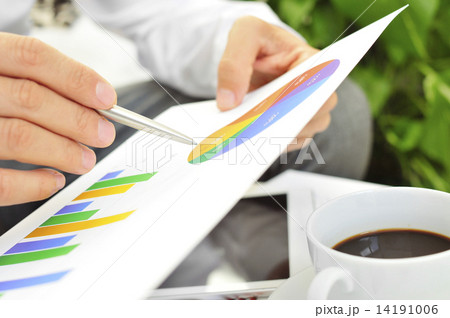 young businessman checking some charts young businessman checking some charts 14191006