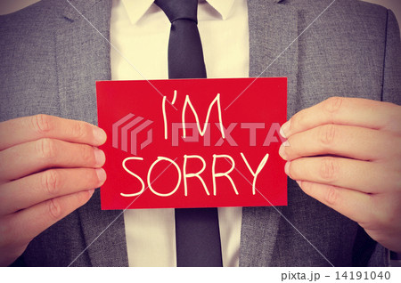 man with signboard with the text I am sorry 14191040