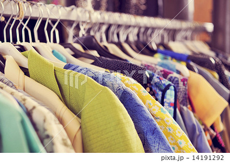 clothes hanging on a rack in a flea market 14191292