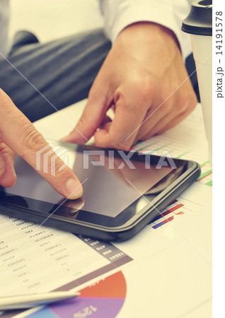 young businessman using a tablet computer young businessman using a tablet computer 14191578