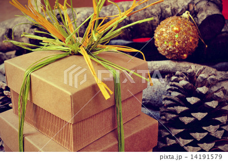 gift boxes tied with natural raffia of different colors on a rus 14191579