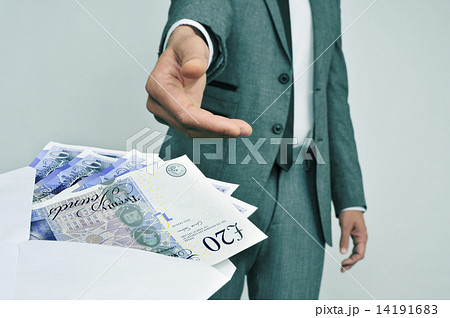 man taking an envelope full of pound sterling bills 14191683
