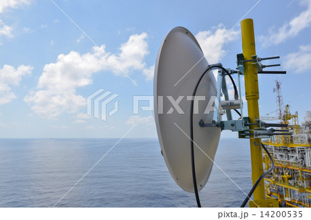 Satellite dish antennas under sky, Communication equipment in offshore oil and gas industry. 14200535