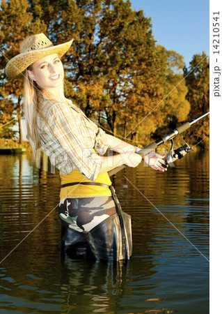 woman fishing in pond woman fishing in pond 14210541