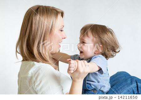 Mom and kid having fun pastime. Parenthood happiness conception. Mom and kid having fun pastime. Parenthood happiness conception. 14211650
