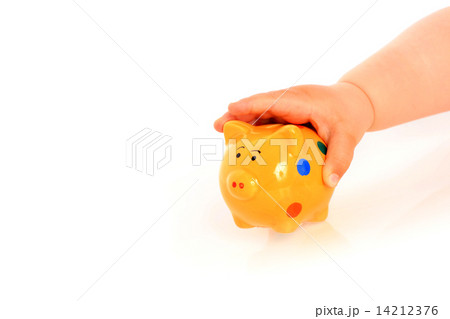Kid hand and piggybank. Kid hand and piggybank. 14212376