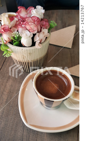 Coffee cup or fresh coffee on wooden table in morning time. Coffee cup or fresh coffee on wooden table in morning time. 14213767
