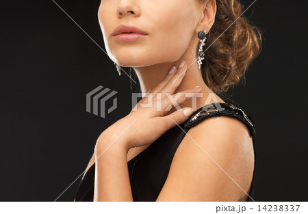 woman with diamond earrings woman with diamond earrings 14238337