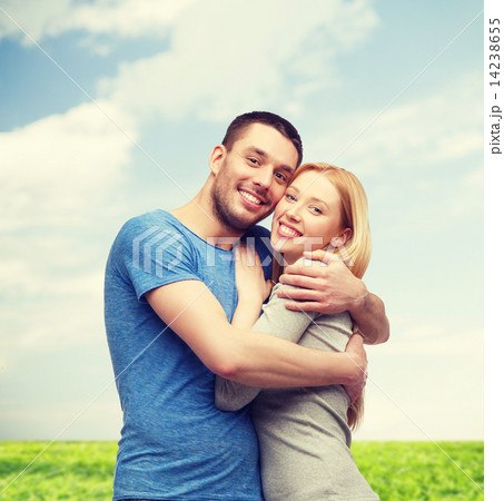 smiling couple hugging 14238655