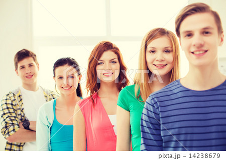 smiling male student with group of classmates smiling male student with group of classmates 14238679
