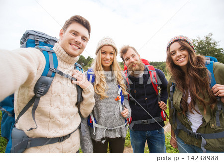 group of smiling friends with backpacks hiking group of smiling friends with backpacks hiking 14238988