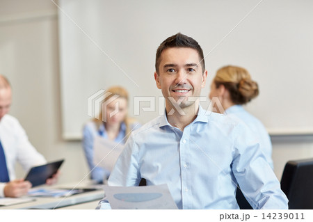 smiling group of businesspeople meeting in office smiling group of businesspeople meeting in office 14239011