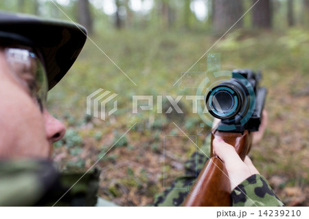 close up of soldier or sniper with gun in forest close up of soldier or sniper with gun in forest 14239210
