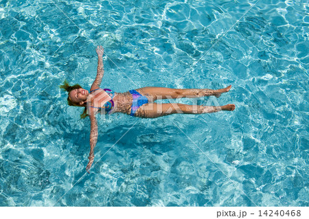 The woman swims in the sea The woman swims in the sea 14240468