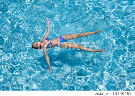 The woman swims in the sea The woman swims in the sea 14240469
