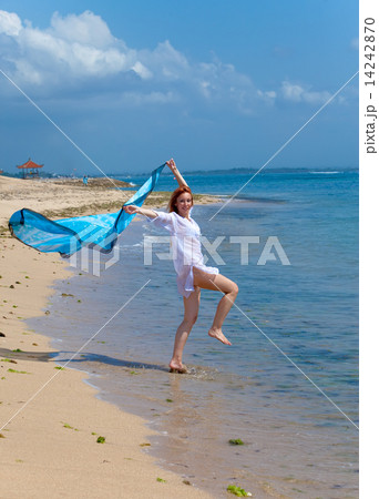 The young attractive woman jumping in the sea The young attractive woman jumping in the sea 14242870