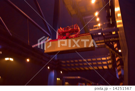 Container Cargo operation in busy Port Terminal with Ship moored alongside by night Container Cargo operation in busy Port Terminal with Ship moored alongside by night 14251567