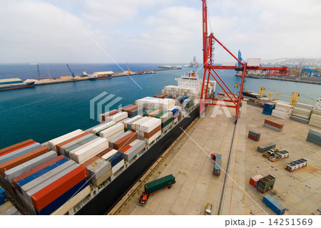 Container Cargo operation in busy Port Terminal with Ship moored alongside . view from the top crane 14251569