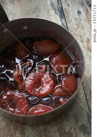 poached prunes and cherries in pot 14251711