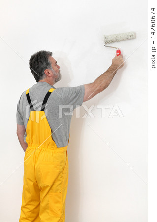 Worker painting  in a room, home renovation 14260674